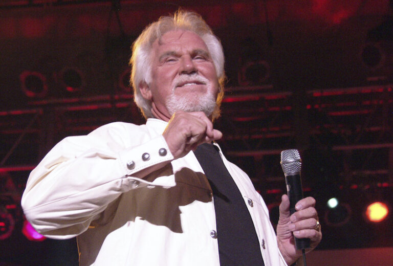 AP File Photo: Kenny Rogers Has Passed Away at 81. AUGUST 14: Kenny Rogers performs at Chastain Park Amphitheatre in Atlanta, Georgia on August 14, 2002. (AP/ Chris McKay / MediaPunch /IPX)