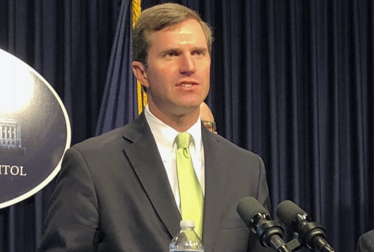 Kentucky Gov. Andy Beshear discusses developments in Kentucky regarding the new coronavirus in Frankfort, Ky. (AP Photo/Bruce Schreiner)