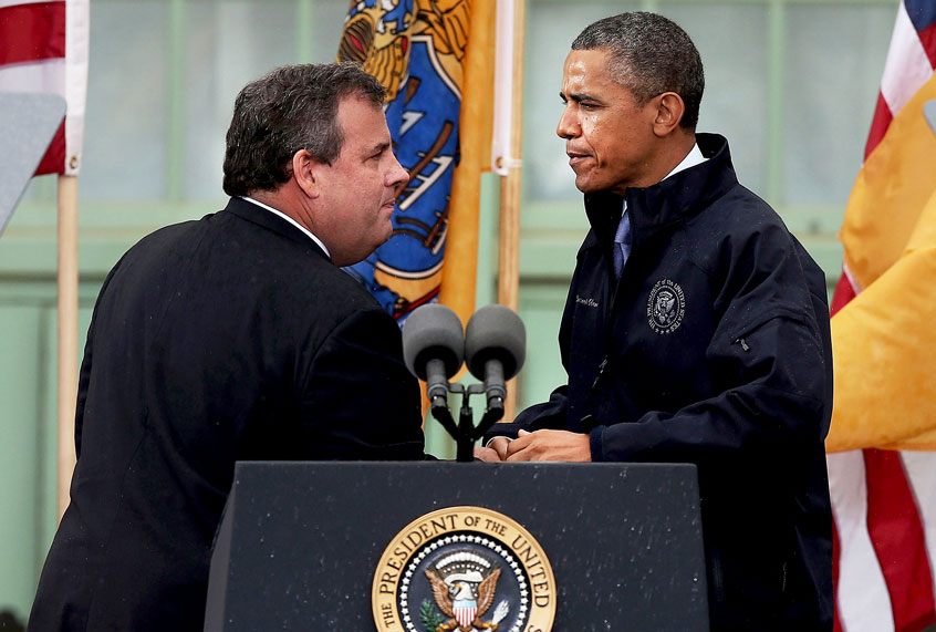 President Barack Obama stands with New Jersey Gov. Chris Christie before speaking to crowds along a rain soaked boardwalk on May 28, 2013 in Asbury Park, New Jersey. Seven months after Superstorm Sandy devastated the region, President Obama declared that the Jersey Shore is back in an appearance with the governor. (Spencer Platt/Getty Images)