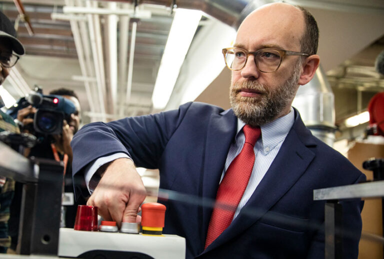 In 2020, then-Acting Director of the Office of Management and Budget Russ Vought started the machine that printed copies of US President Donald Trump's proposed budget for the U.S. Government for the 2021 Fiscal Year at the Government Publishing Office ahead of its release (Samuel Corum/Getty Images)