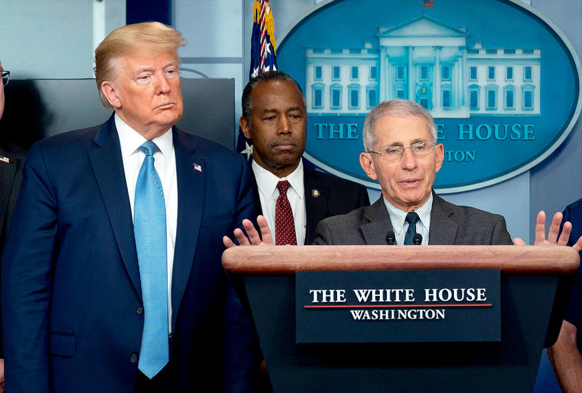 US President Donald Trump and other members of the task force listen as National Institute of Allergy and Infectious Diseases Director, Dr. Anthony Fauci, speaks during the daily briefing on the novel coronavirus, COVID-19, at the White House on March 21, 2020, in Washington, DC. (JIM WATSON/AFP via Getty Images)