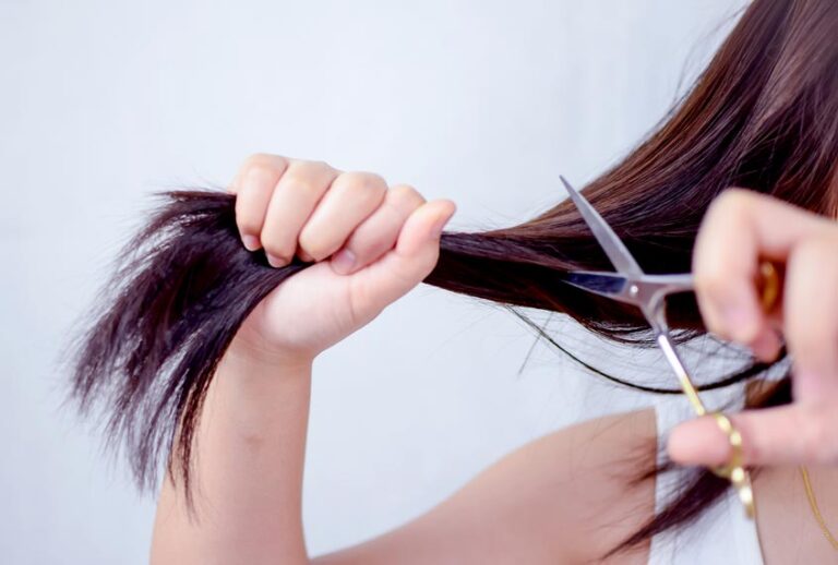 Woman Cutting Hair (Getty Images)
