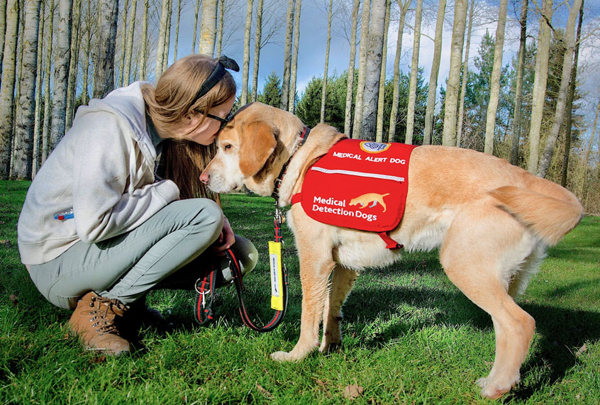 Jodie Griffin suffers from unpredictable episodes of losing consciousness. Her medical alert dog, Nimbus, was trained to alert to the scent she emits before an episode. She says he has changed her life, allowing her to go out in the world without fear of collapsing without warning. (Jodie Griffin)