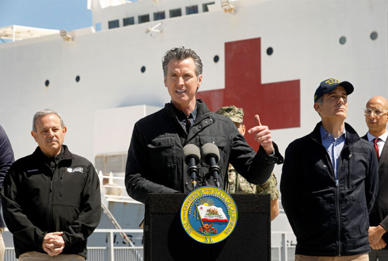 California Governor Gavin Newsom speaks in front of the hospital ship USNS Mercy (Carolyn Cole-Pool/Getty Images)