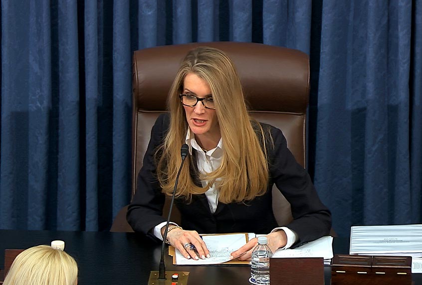 Sen. Kelly Loeffler, R-Ga., speaks on the Senate floor at the U.S. Capitol in Washington, Wednesday, March 25, 2020. (Senate Television via AP)