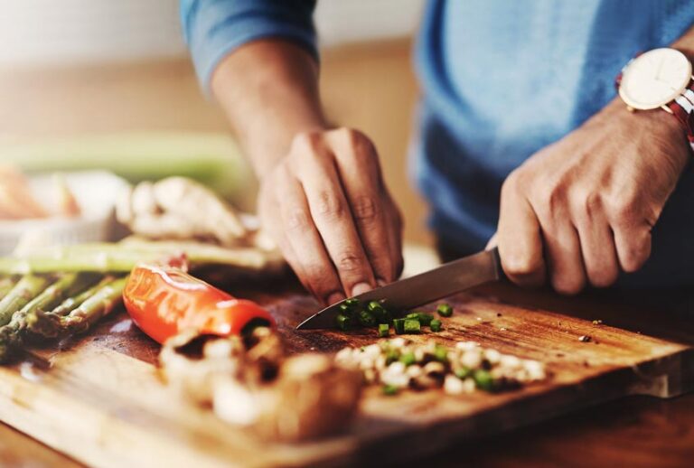 A man preparing a healthy meal at home (Getty Images)