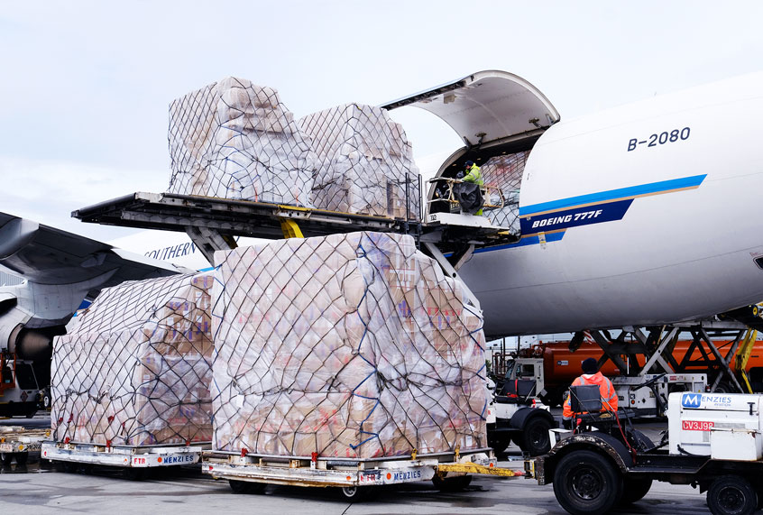 Ground crew at the Los Angeles International airport unload pallets of supplies of medical personal protective equipment, PPE, from a China Southern Cargo plane upon its arrival on Friday, April 10, 2020. (AP Photo/Richard Vogel)