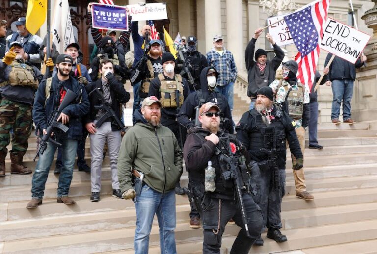People take part in a protest for "Michiganders Against Excessive Quarantine" at the Michigan State Capitol in Lansing, Michigan on April 15, 2020. (Jeff Kowalsky/AFP via Getty)