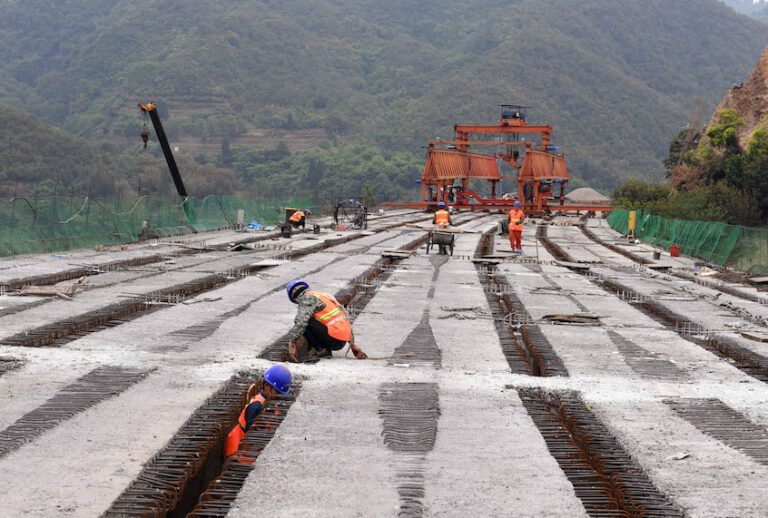 People work at the construction site of Chahe grand bridge of the Kunming-Chuxiong expressway in southwest China's Yunnan Province, April 28, 2020. (Xinhua/Yang Zongyou via Getty Images)