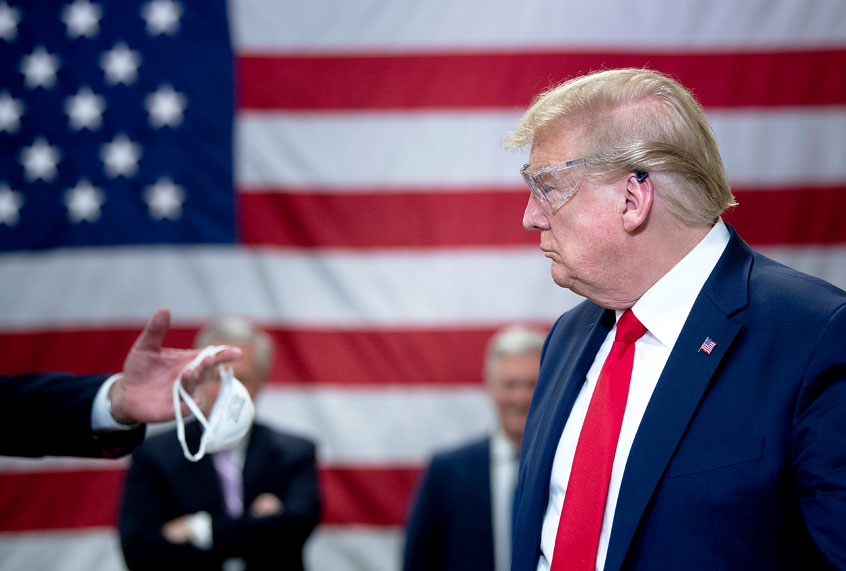 US President Donald Trump tours a Honeywell International Inc. factory producing N95 masks during his first trip since widespread COVID-19 related lockdowns went into effect May 5, 2020, in Phoenix, Arizona. (BRENDAN SMIALOWSKI/AFP/Getty Images)