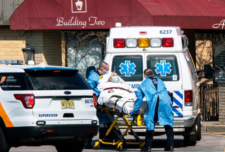 Medical workers load a patient from Andover Subacute and Rehabilitation Center into an ambulance while wearing masks and personal protective equipment (PPE) in Andover, New Jersey. After an anonymous tip to police, 17 people were found dead at the long-term care facility, including two nurses, where at least 76 patients and 41 staff members have tested positive for COVID-19. (Eduardo Munoz Alvarez/Getty Images)