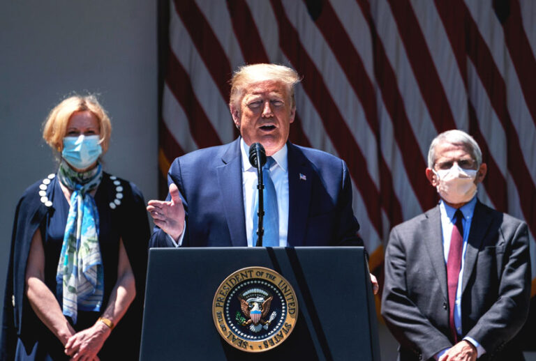 Flanked by White House coronavirus response coordinator Dr. Deborah Birx (L) and Dr. Anthony Fauci (R), director of the NIH, U.S. President Donald Trump delivers remarks about coronavirus vaccine development in the Rose Garden of the White House (Drew Angerer/Getty Images)