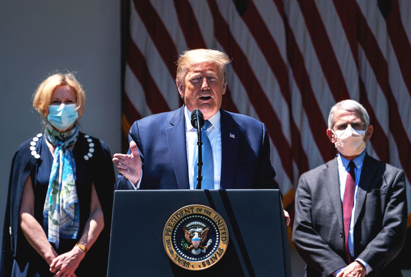 Flanked by White House coronavirus response coordinator Dr. Deborah Birx (L) and Dr. Anthony Fauci (R), director of the NIH, U.S. President Donald Trump delivers remarks about coronavirus vaccine development in the Rose Garden of the White House (Drew Angerer/Getty Images)