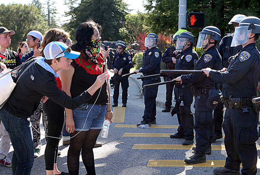 University of California police contain demonstrators Wednesday at the intersection of Bay and High streets, an entrance to the UC Santa Cruz campus. (Dan Coyro/Santa Cruz Sentinel)