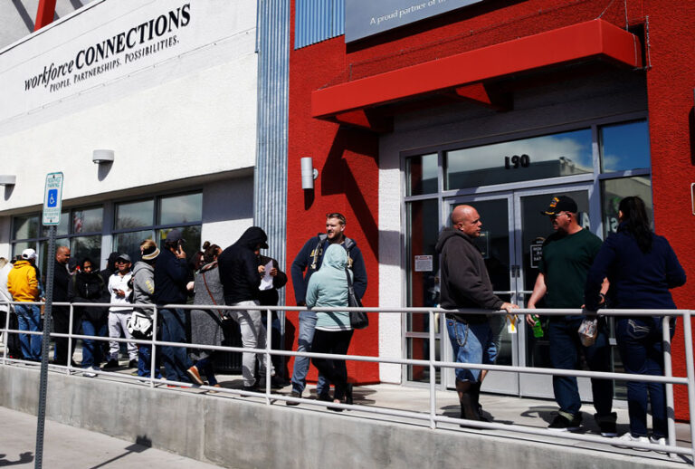 People wait in line for help with unemployment benefits at the One-Stop Career Center, in Las Vegas, Nevada. (AP Photo/John Locher)