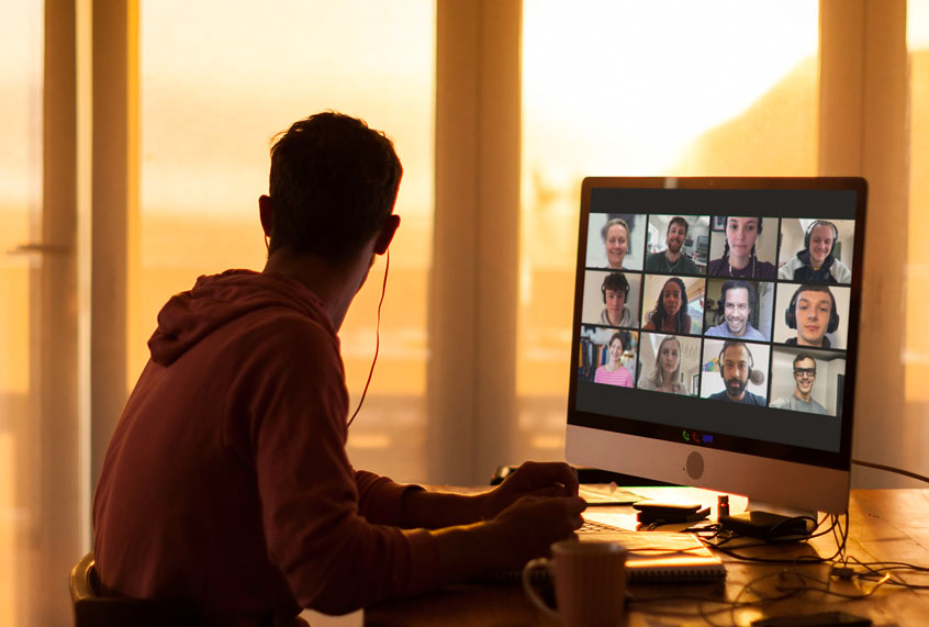 Young man distracted while on video call from his home during lockdown (Getty Images)