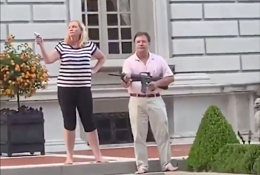 A couple in St. Louis, Missouri pulled guns on peaceful protesters passing through the neighborhood (Twitter/@ABC)