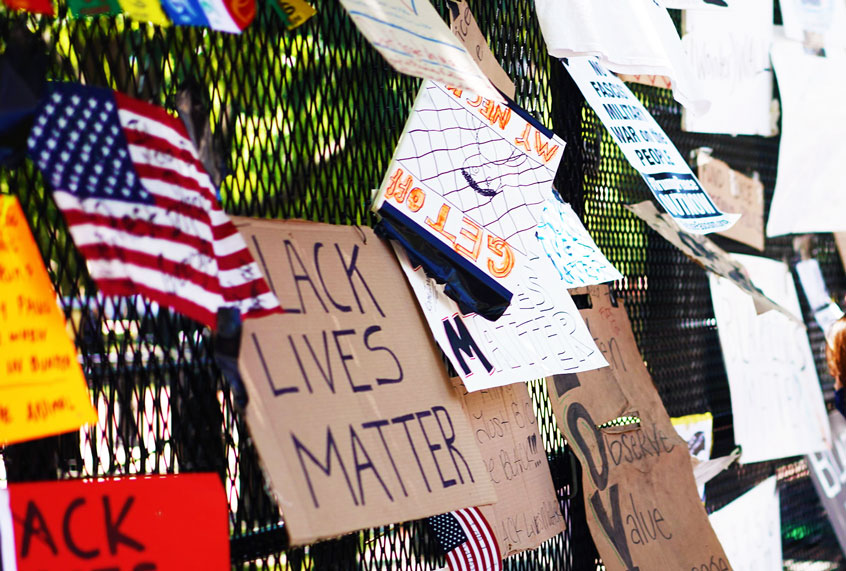 Posters and placards on the security fence on the north side of Lafayette Square, near the White House, in Washington, DC (Getty Images)
