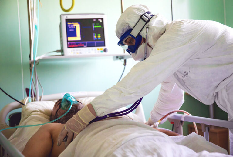 A medical staff member attends a patient in an intensive care unit for COVID-19 patients (Yelena AfoninaTASS via Getty Images)