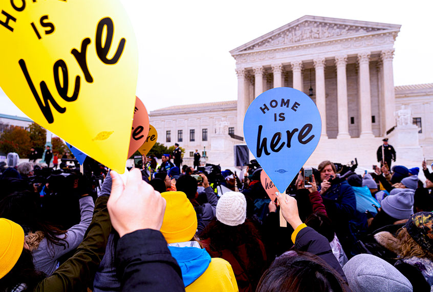 "Home is Here" say supporters of the Deferred Action for Childhood Arrivals, or DACA, assembled in front of the steps of the U.S. Supreme Court on Tuesday, Nov. 12, 2019 in Washington D.C. as the justices considered whether the Trump administration can shut down a program that shields about 700,000 young immigrants, known as "dreamers", from deportation. (Photo by Jeff Malet)