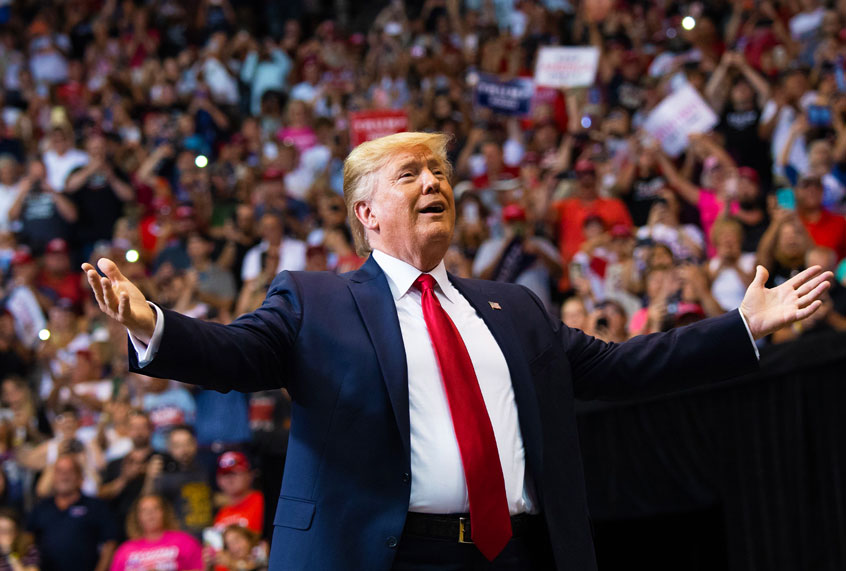 US President Donald Trump gestures as he arrives to a "Make America Great Again" campaign rally (SAUL LOEB/AFP/Getty Images)