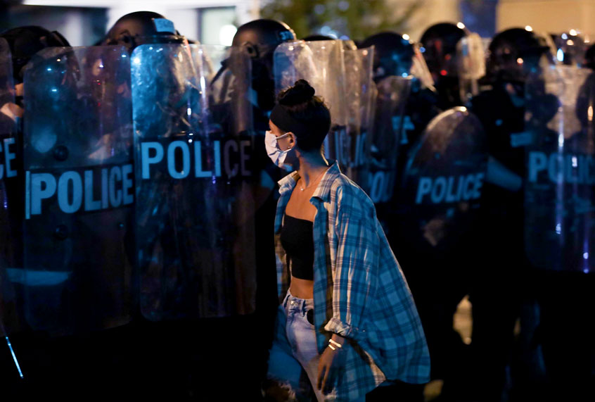 A demonstrator is seen in front of a police barricade during a protest over the death of George Floyd, an unarmed black man who died after being pinned down by a white police officer (Yasin Ozturk/Anadolu Agency via Getty Images)