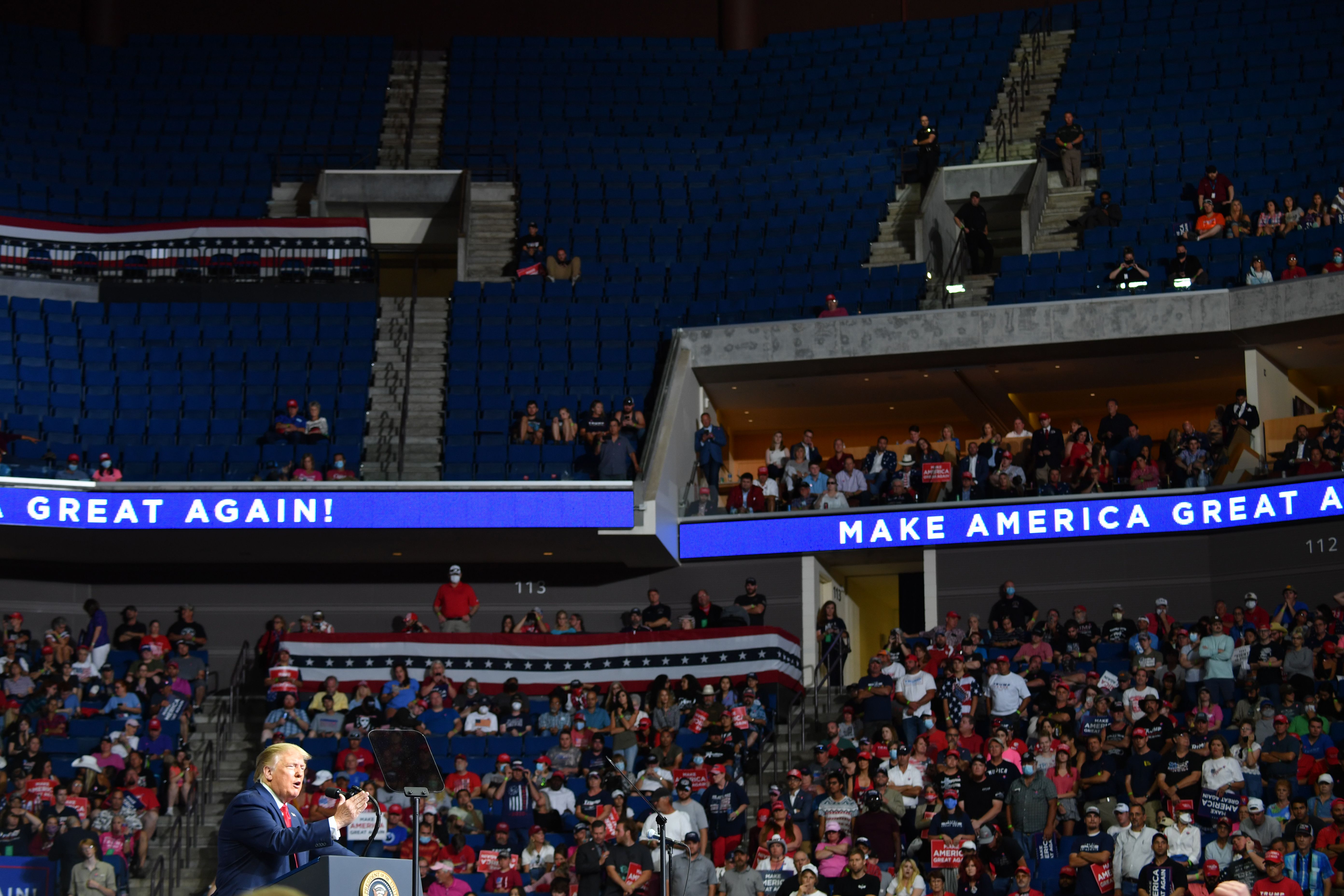 The upper section of the arena is seen partially empty as US President Donald Trump speaks during a campaign rally at the BOK Center on June 20, 2020 in Tulsa, Oklahoma. - Hundreds of supporters lined up early for Donald Trump's first political rally in months, saying the risk of contracting COVID-19 in a big, packed arena would not keep them from hearing the president's campaign message. (Photo by Nicholas Kamm/AFP via Getty Images)