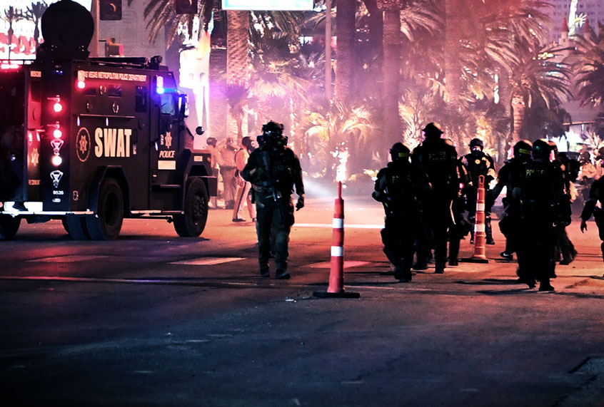 Las Vegas Metropolitan Police Officers walk down Las Vegas Boulevard during a Black Lives Matter demonstration demanding justice for the death of George Floyd ( Denise Truscello/Getty Images)