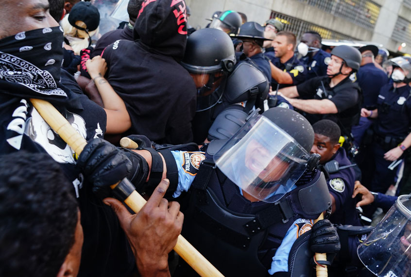 Police officers clash with protesters during a demonstration over the Minneapolis death of George Floyd while in police custody on May 29, 2020 in Atlanta, Georgia. (Elijah Nouvelage/Getty Images)