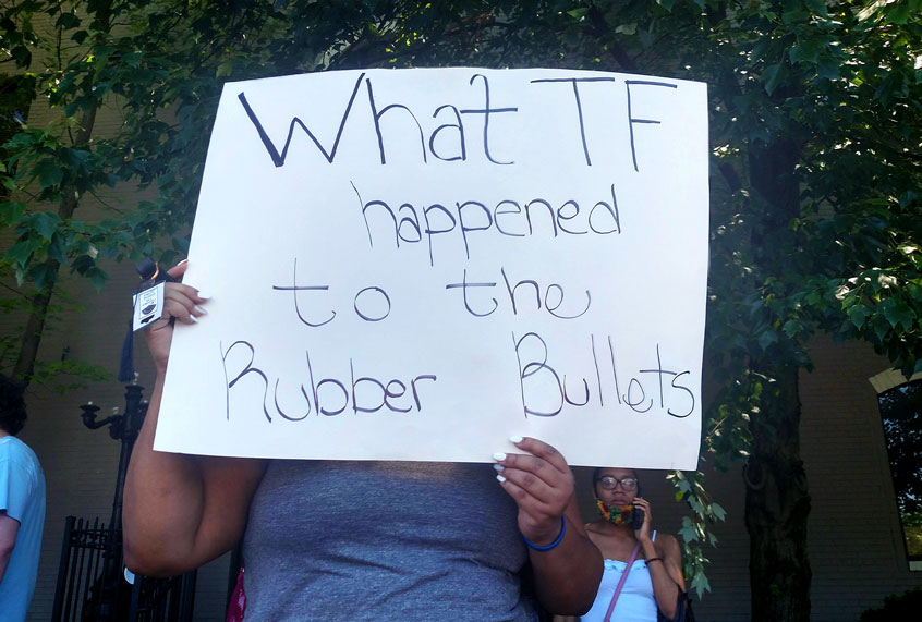 Protestor at the site of David Mcatee's death (Ashlie Stevens)