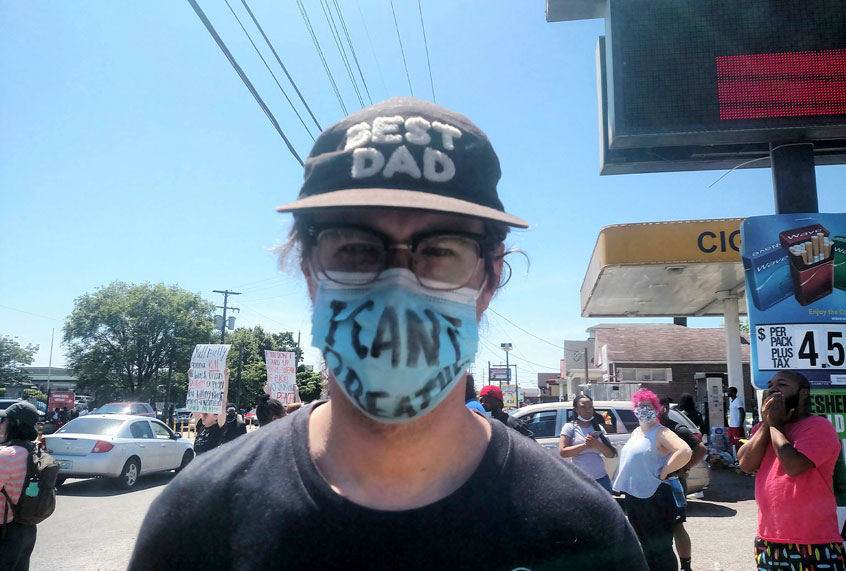 Protestor at the site of David Mcatee's death (Ashlie Stevens)