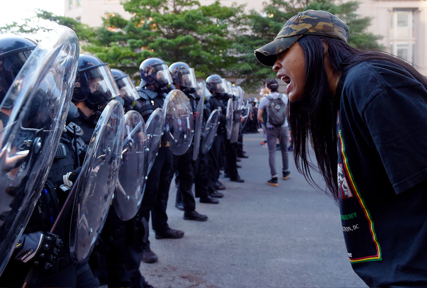 A protester screams in front of a row of police officers during a demonstration against the death of George Floyd at a park near the White House on June 1, 2020 in Washington, DC. (OLIVIER DOULIERY/AFP via Getty Images)