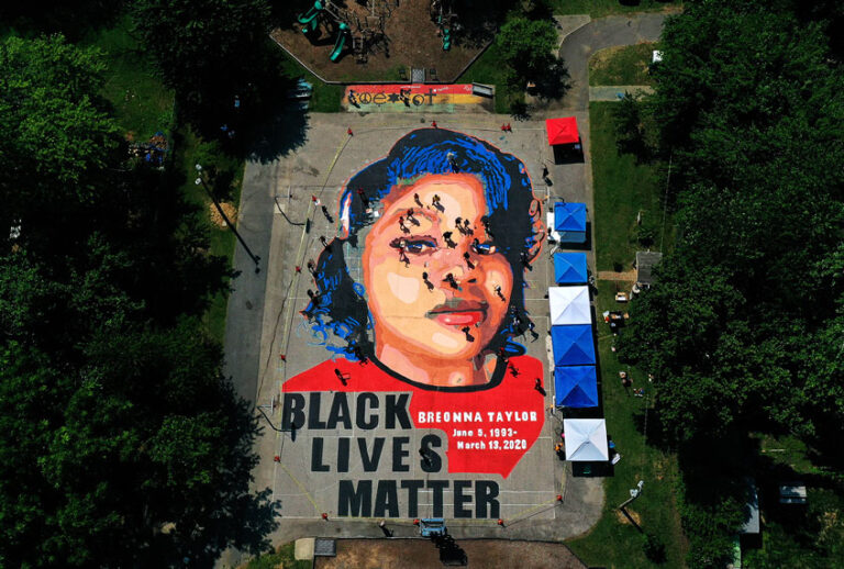 In an aerial view from a drone, a large-scale ground mural depicting Breonna Taylor with the text 'Black Lives Matter' is seen being painted at Chambers Park on July 5, 2020 in Annapolis, Maryland. (Patrick Smith/Getty Images)