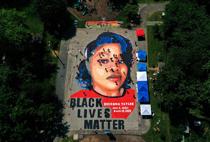 In an aerial view from a drone, a large-scale ground mural depicting Breonna Taylor with the text 'Black Lives Matter' is seen being painted at Chambers Park on July 5, 2020 in Annapolis, Maryland. (Patrick Smith/Getty Images)