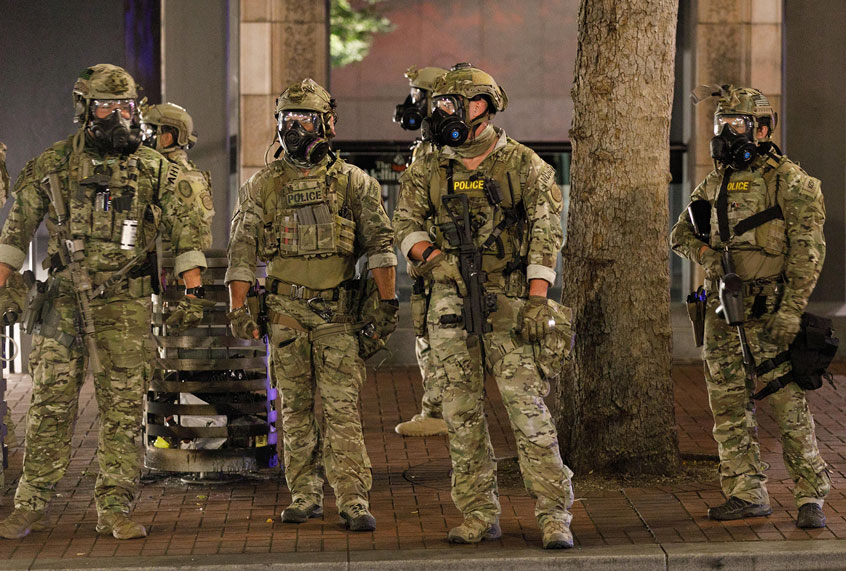 Police confront demonstrators as Black Lives Matter supporters demonstrate in Portland, Oregon on July 4, 2020 for the thirty-eighth day in a row at Portland's Justice Center and throughout Portland, with a riot declared about 12.20 am on July 5. CS tear gas and less-lethal weapons were used, and multiple arrests were made. (John Rudoff/Anadolu Agency via Getty Images)