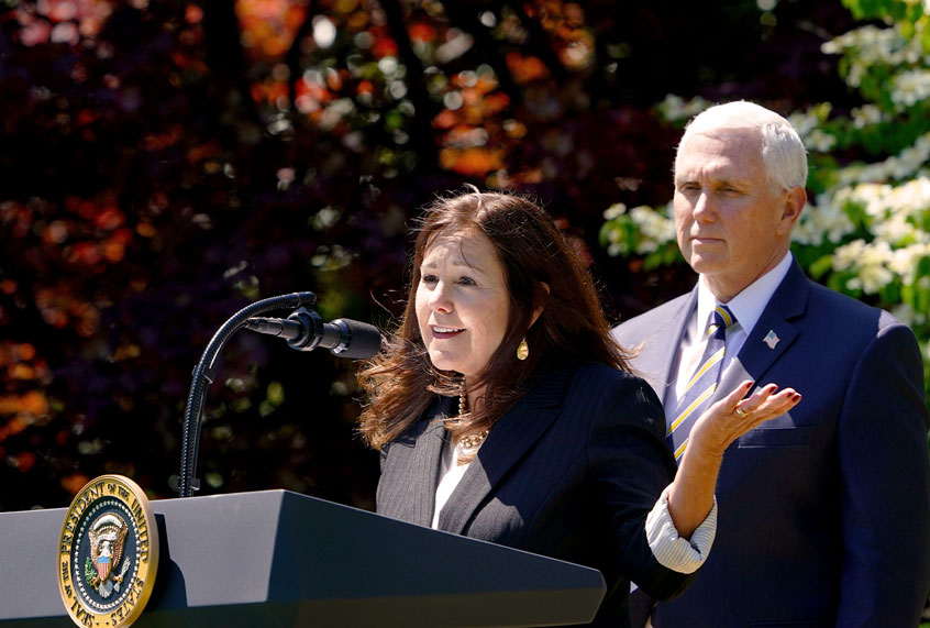 Vice President Mike Pence listens as his wife Karen Pence (MANDEL NGAN/AFP via Getty Images)