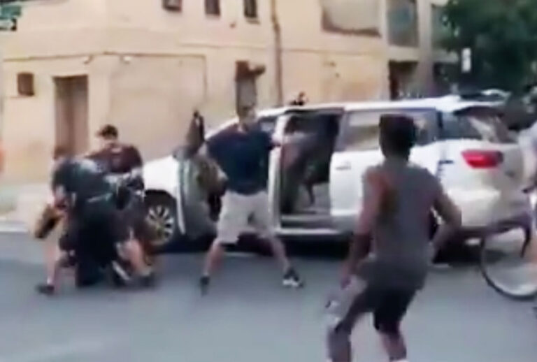 Plain-clothes NYPD officers pulling a protester into an unmarked van at the Abolition Park protest in NYC. (Twitter/@MichelleLhooq)