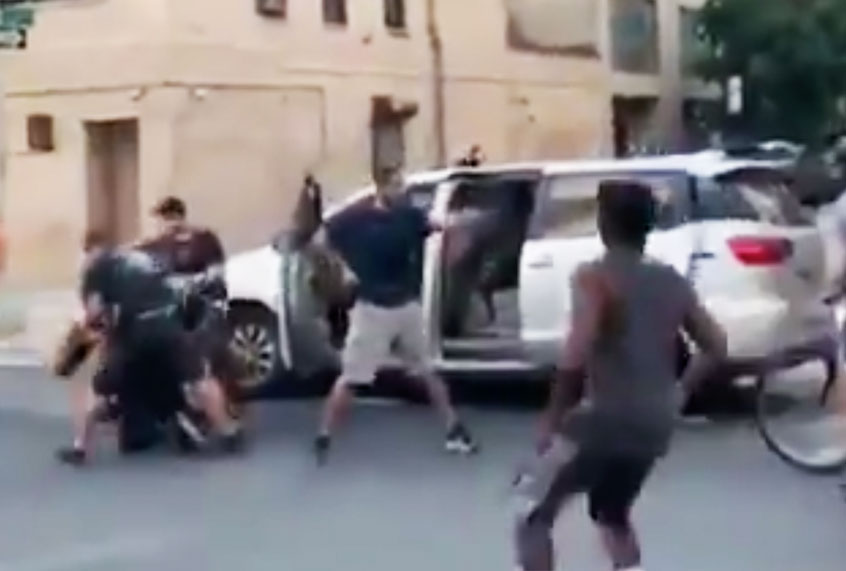Plain-clothes NYPD officers pulling a protester into an unmarked van at the Abolition Park protest in NYC. (Twitter/@MichelleLhooq)