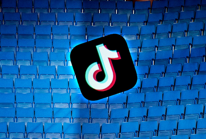 Empty bleachers at Trump's campaign rally in Tulsa | Tiktok app logo (Getty Images/Salon)