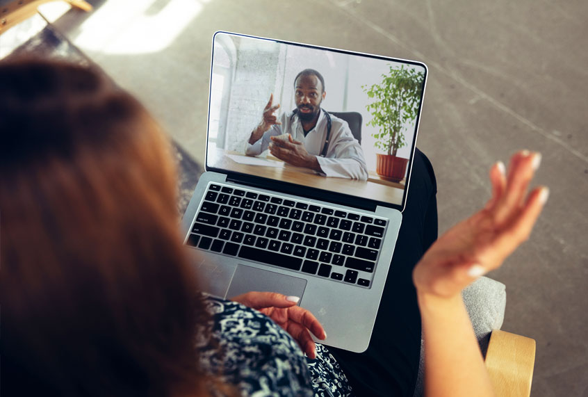Close up of young woman getting online medical help and advice during videocall with doctor (Getty Images)