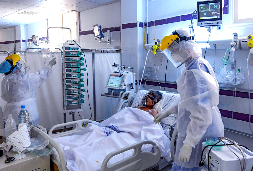 A patient infected by the covid-19 caused by the novel coronavirus receives treatment at the intensive care unit of a hospital in the southwestern Tunisian town of Gabes on August 26, 2020, as cases of infection surge there. (FETHI BELAID/AFP via Getty Images)