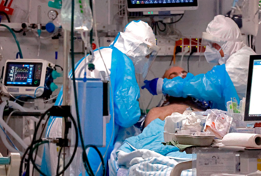 edics work with a COVID-19 patient at the isolation ward of Sheba Medical Center in Ramat Gan near the coastal city of Tel Aviv, on July 29, 2020. (JACK GUEZ/AFP via Getty Images)