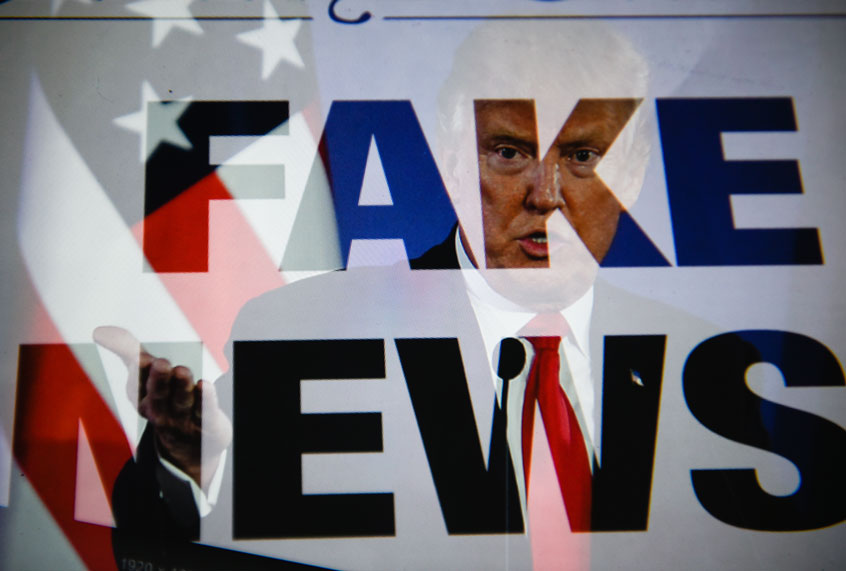 In this photo illustration a double exposure image shows the President of United States of America, Donald Trump with a sentence saying "Fake news". (Omar Marques/SOPA Images/LightRocket via Getty Images)