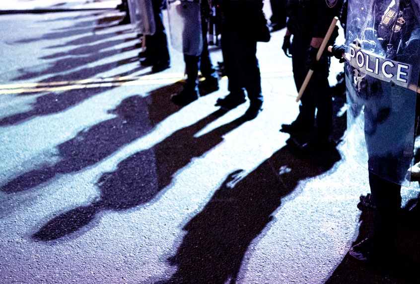 Federal officers line up prior to a crowd dispersal of about 300 protesters in front of the Immigration and Customs Enforcement (ICE) detention building on August 26, 2020 in Portland, Oregon. Protests continued for the 91st night in Portland as activist called for solidarity with rallies in Kenosha, Wisconsin. (Nathan Howard/Getty Images)
