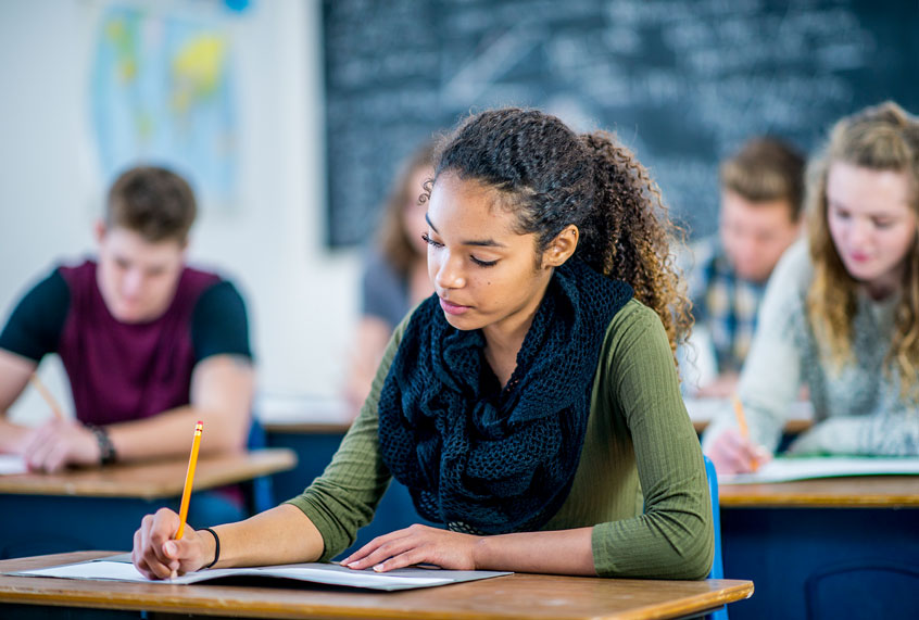A group of students are indoors in their high school classroom (Getty Images)