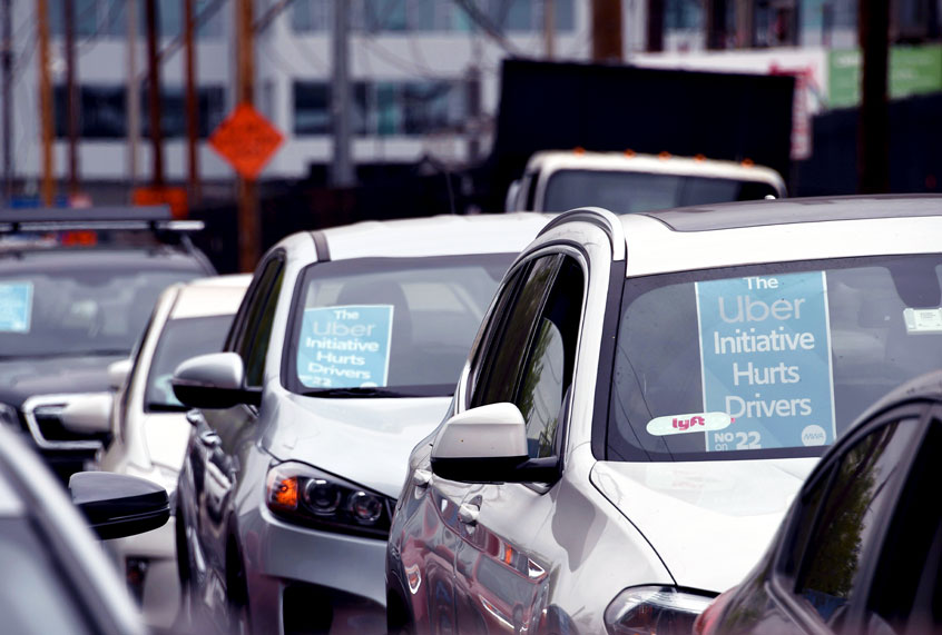 Rideshare drivers demonstrate against rideshare companies Uber and Lyft during a car caravan protest on August 6, 2020 in Los Angeles. (ROBYN BECK/AFP via Getty Images)