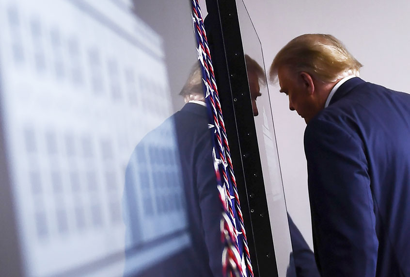 US President Donald Trump leaves after speaking to the press in the Brady Briefing Room of the White House in Washington, DC, on August 3, 2020. (BRENDAN SMIALOWSKI/AFP via Getty Images)