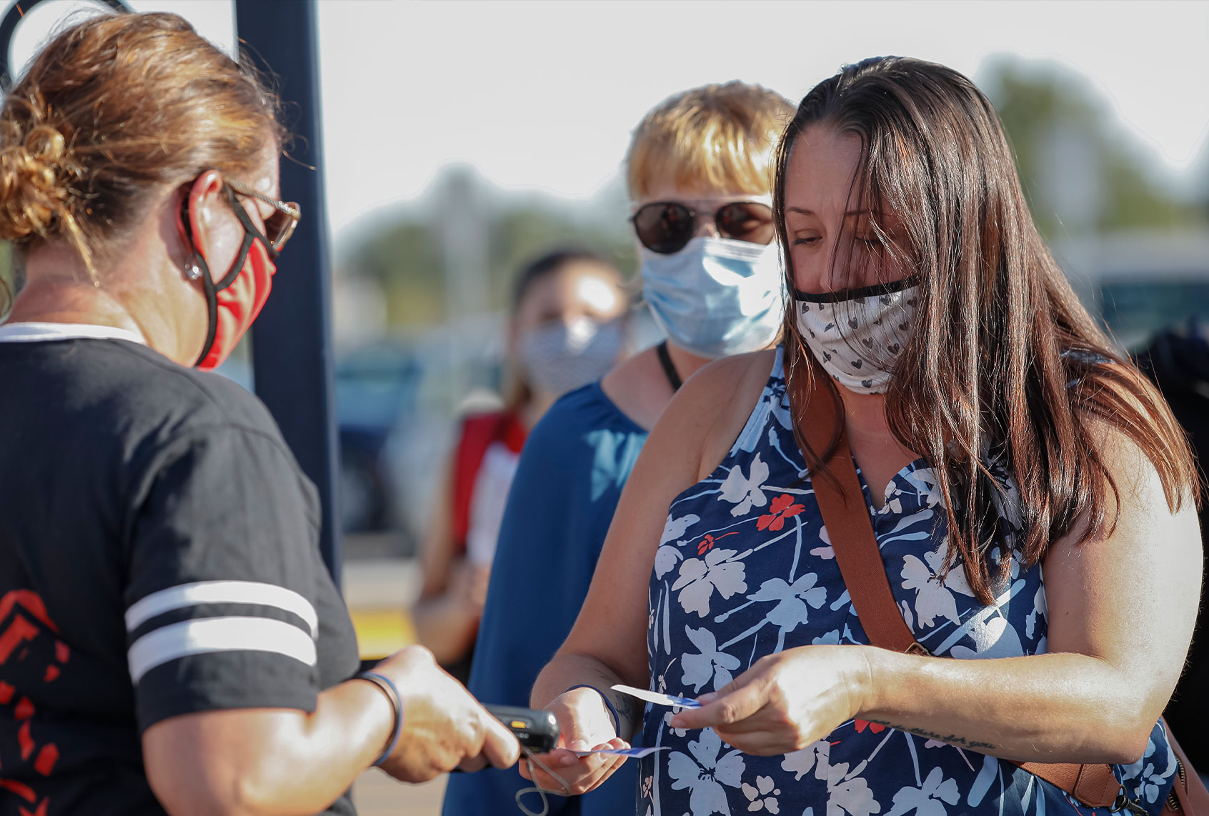 Fans wearing masks enter the game between the Lafayette Jefferson Broncos and West Lafayette Red Devils at Lafayette Jefferson High School on August 21, 2020 in Lafayette, Indiana. (Michael Hickey/Getty Images)