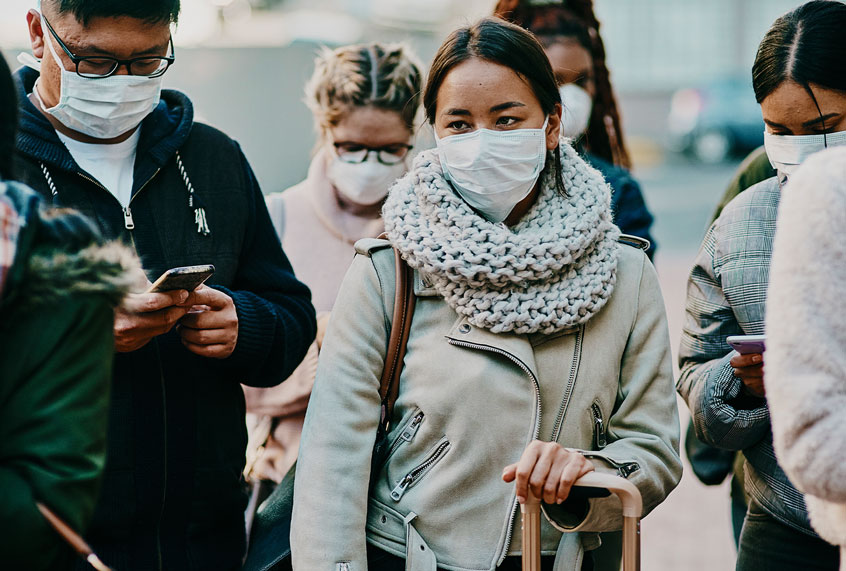 Shot of a group of young people wearing masks (Getty Images)