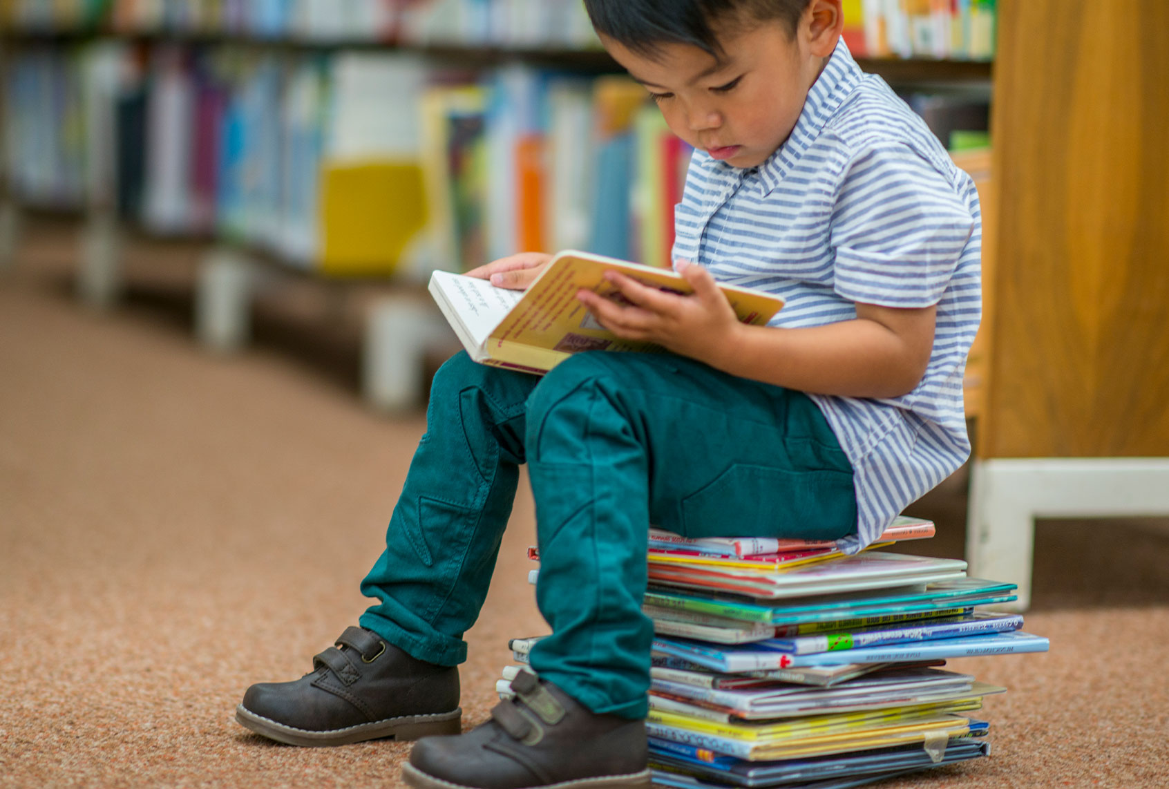 Reading On A Stack Of Books (Getty Images)
